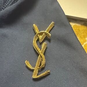 YSL Gold Logo on Black Fabric